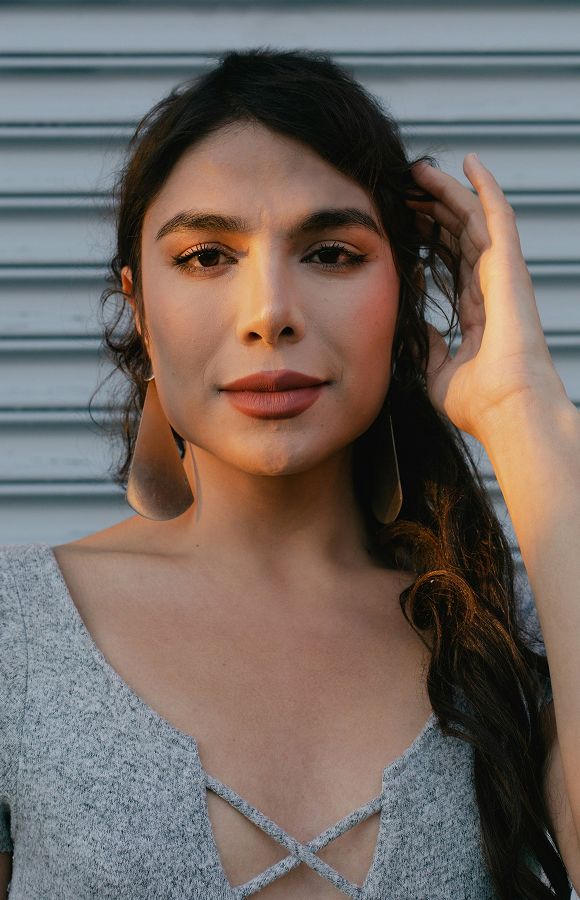 Portrait of a woman with stylish earrings.