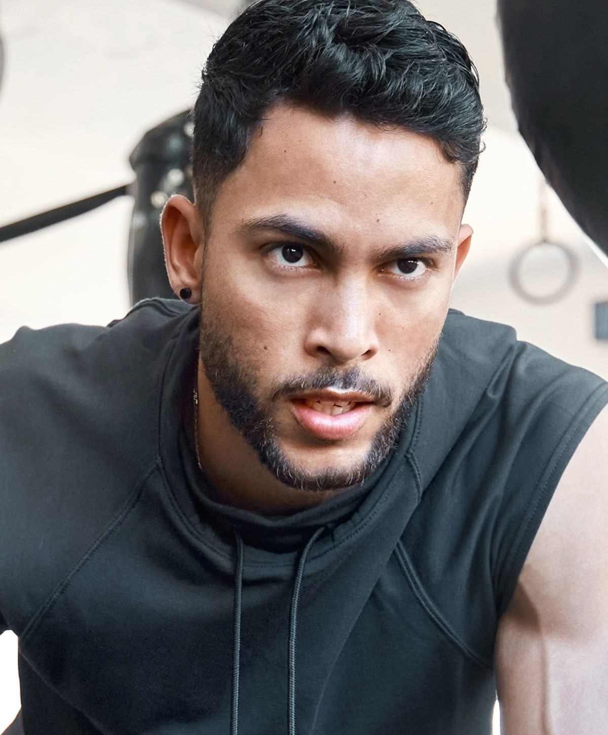 Athletic man posing in studio setting.