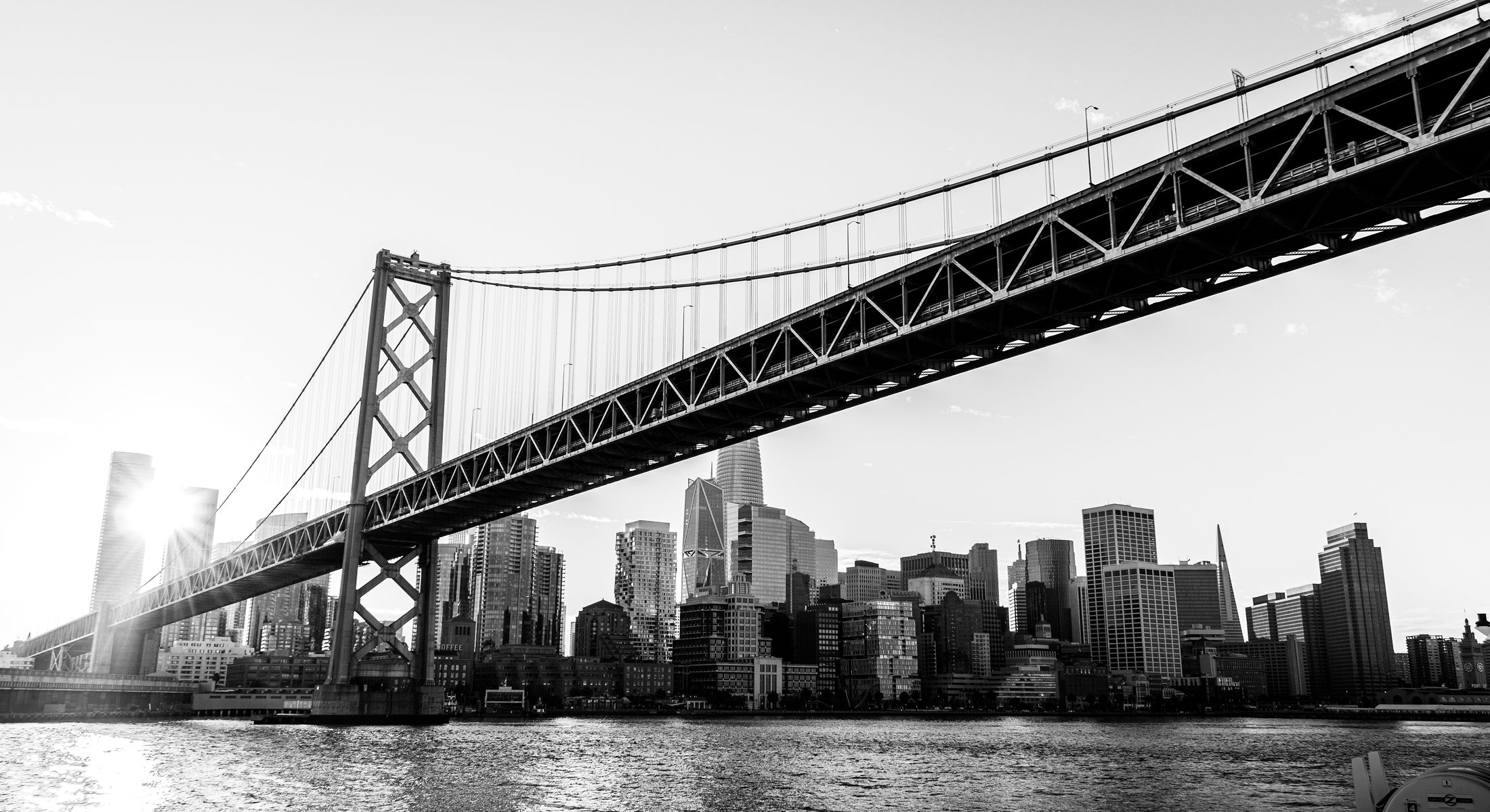 Bay Bridge with San Francisco skyline in black and white.