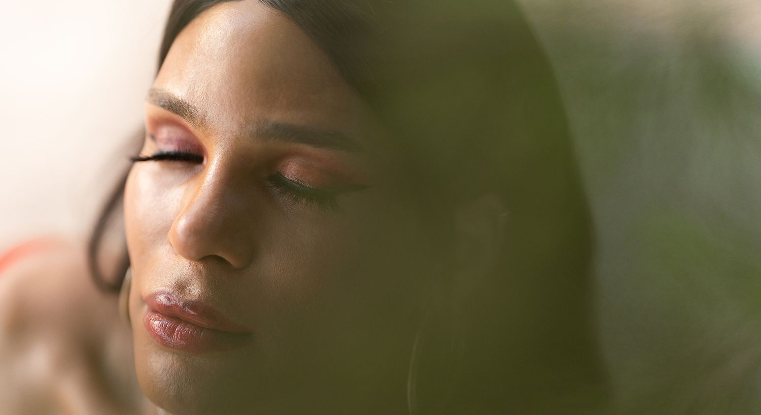 Close-up of a serene face with closed eyes.